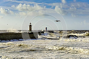 Lighthouse battered by huge waves on Atlantic Ocean