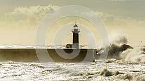 Lighthouse battered by huge waves on Atlantic Ocean