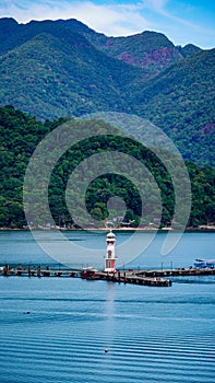 Lighthouse bay, blue lake, Koh Chang Thailand, mountain and water scenery.