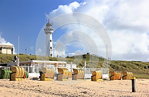 Lighthouse and beach in Egmond aan Zee. North Sea, the Netherlands.