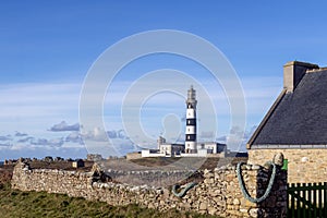 Lighthouse and Beacon of Ouessant, the island of Ushant, in Brittany, french rocky beach in northern France, Finistere