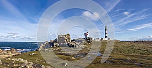 Lighthouse and Beacon of Ouessant, the island of Ushant, in Brittany, french rocky beach in northern France, Finistere