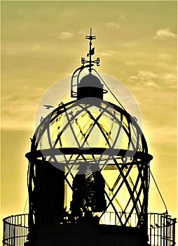 Lighthouse beacon sunrise glow photo