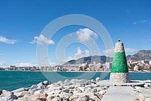 A lighthouse of Benalmadena and a view to Mediterranean sea and coast