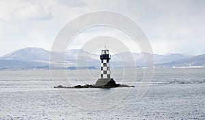 Lighthouse with black and white chequer design
