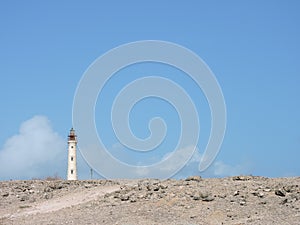 The lighthouse in blue sky photo