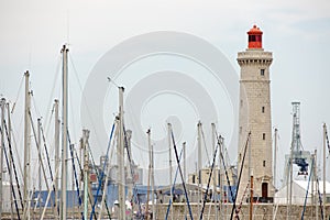 Lighthouse and boat mast