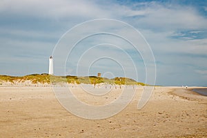 Lighthouse and bunker in the sand dunes on the beach of Blavand, Jutland Denmark Europe