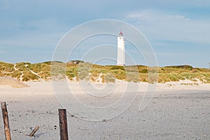 Lighthouse and bunker in the sand dunes on the beach of Blavand, Jutland Denmark Europe