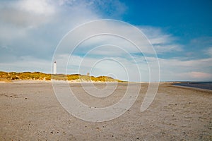 Lighthouse and bunker in the sand dunes on the beach of Blavand, Jutland Denmark Europe