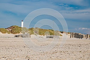 Lighthouse and bunkers in the sand dunes on the beach of Blavand, Jutland Denmark Europe