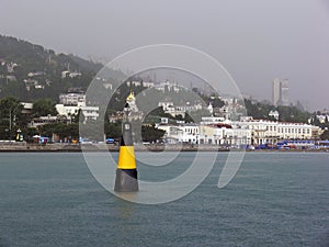 Lighthouse buoy at sea