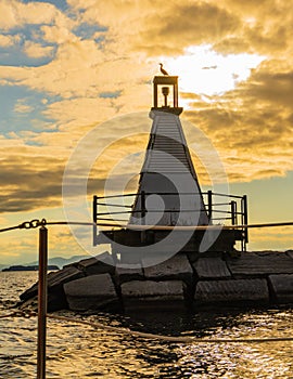 lighthouse in Burlington, Vermont harbor at sunset