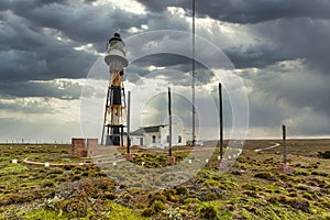 Lighthouse of Cabo Virgenes, Strait of Magellan, Argentina photo