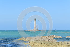 The Lighthouse of Cap de la Hague at low tide in Europe, France, Normandy, Manche, spring, on a sunny day