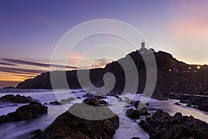 Lighthouse clouds sunset img