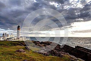 Lighthouse cloudscape photo