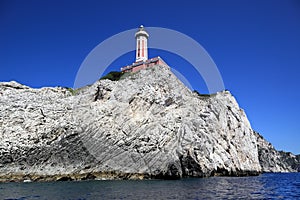Lighthouse on coast of Tyrrhenian sea, Capri island - Italy