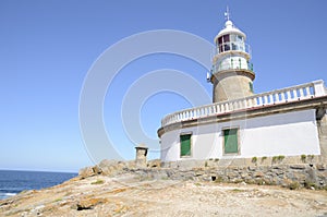 Lighthouse in the coastline of Corrubedo photo