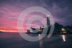 Lighthouse at colorful sunrise