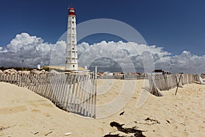 Lighthouse on Culatra Island in Ria Formosa, Portugal photo