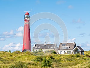 Lighthouse in dunes of Schiermonnikoog, West-Frisian island, Netherlands photo