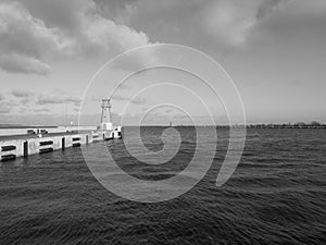 Lighthouse on e trance in Port of Gdansk, Poland. Gulf of Gdansk, Baltic Sea. Artistic Look in black and white.