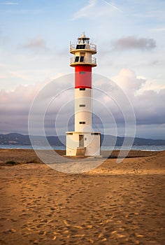 Lighthouse at El Fangar Beach at sunset, Catalonia