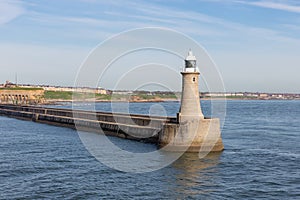 Lighthouse at end of breakwater harbor Newcastle at river Tyne