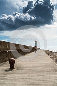 Lighthouse at the end of jetty and seawall, Berwick upon Tweed,