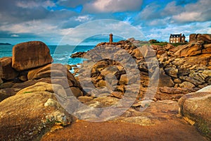 Lighthouse and granite rocks on the Atlantic coastline, Ploumanach, France