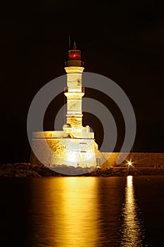 Lighthouse in harbor of Chania at night. Greece island of Crete