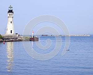 Lighthouse At Harbor Entrance