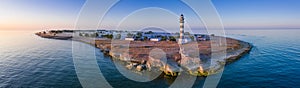 Lighthouse and hause on the small island in the Baltic Sea. Architecture on the Osmussaar