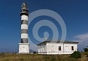 Lighthouse and hause on the small island in the Baltic Sea. Architecture in Osmussaar