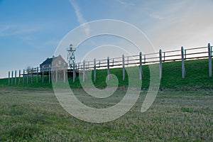 Lighthouse and house of the lighthouse watcher on the former island Schokland.