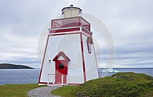 Lighthouse with iceberg, Newfoundland