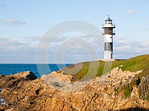 Lighthouse in Illa Pancha, Lugo, Galicia, Spain. photo