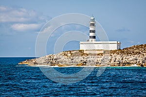 Lighthouse on Isla de Es Penjats near Ibiza, Balearic Islands, S photo