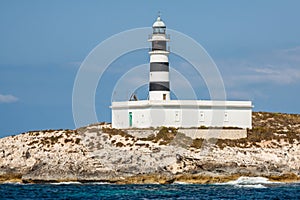 Lighthouse on Isla de Es Penjats near Ibiza, Balearic Islands, S photo