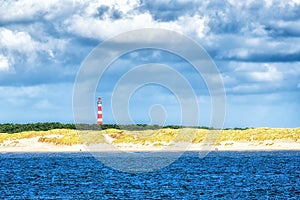 Lighthouse on island of Ameland with blue sky, The Netherlands