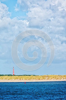 Lighthouse on island of Ameland with blue sky, The Netherlands