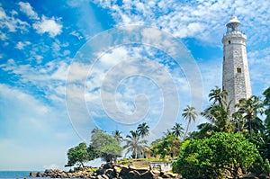 Lighthouse, lagoon and tropical palms Matara Sri Lanka.