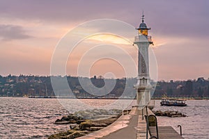 Lighthouse in Lake Geneva at sunrise in Switzerland