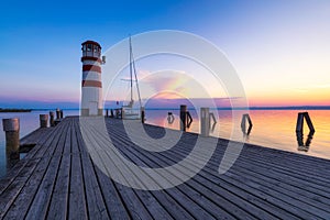 Lighthouse at Lake Neusiedl, Podersdorf am See, Burgenland, Austria. Lighthouse at sunset in Austria. Wooden pier with lighthouse