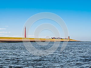 Lighthouse Lange Jaap at North Sea coast, Huisduinen, Den Helder, Netherlands photo