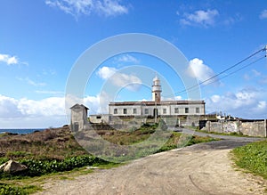 Lighthouse of Larino or Punta Insua Lighthouse is located on a headland at Larino. Carnota, La Coruna, Galicia, Spain photo