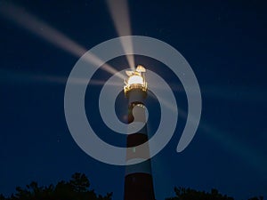 Lighthouse with light rays during night on the island of Ameland  Hollum  Netherlands