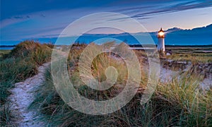 Lighthouse List West at sunset with clouds