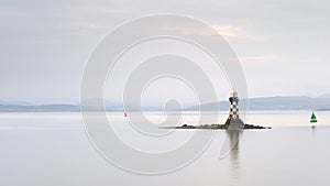 Lighthouse low tide on island sunset sky water peaceful calm ocean sea black white port glasgow greenock Inverclyde Scotland uk